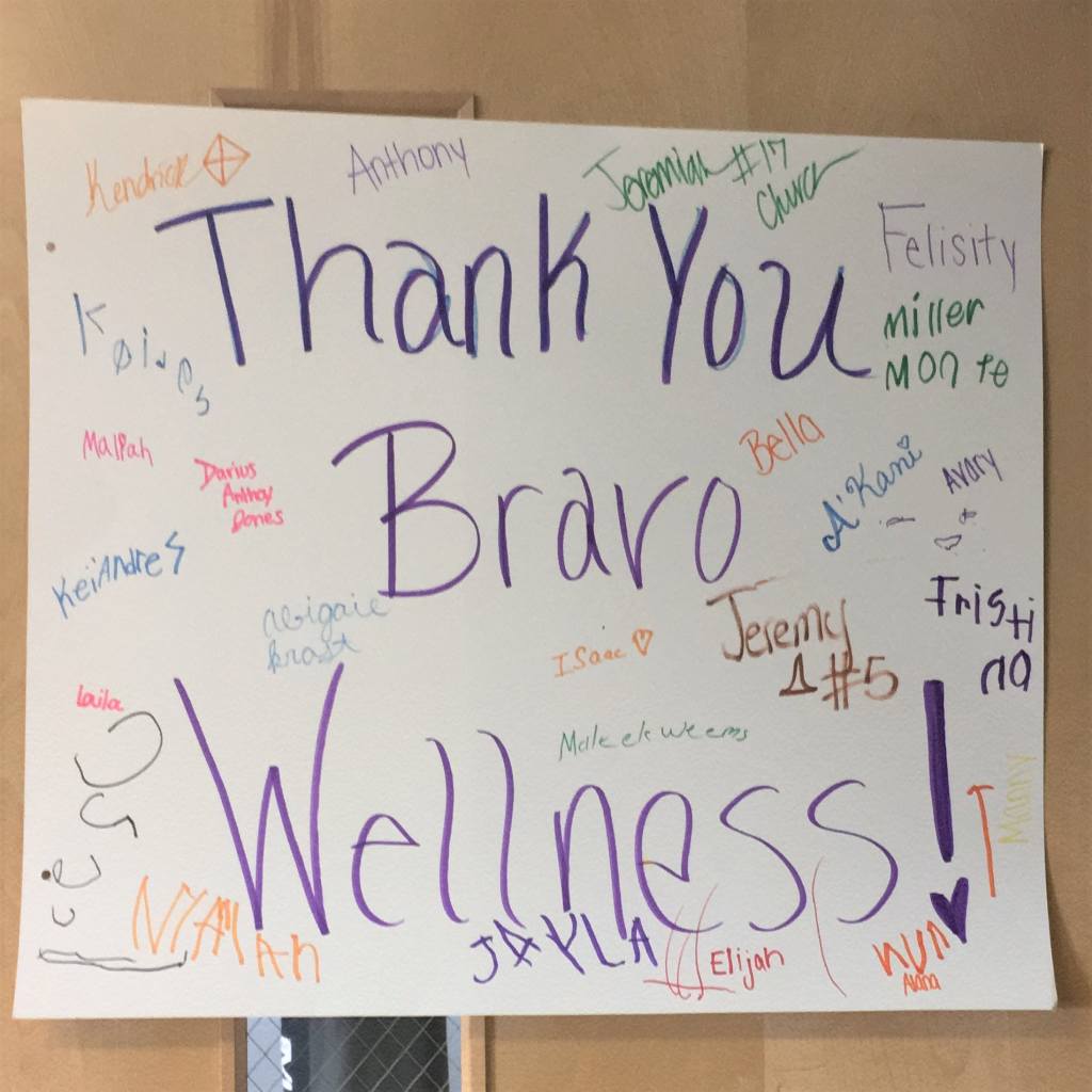The kids who benefited from the matching donation, wrote a Thank You note to Bravo Wellness. Each of them signed it and hung it on the door.
