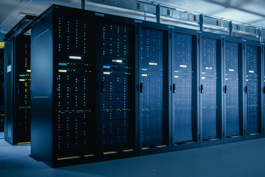 A server room with rows of physical servers.