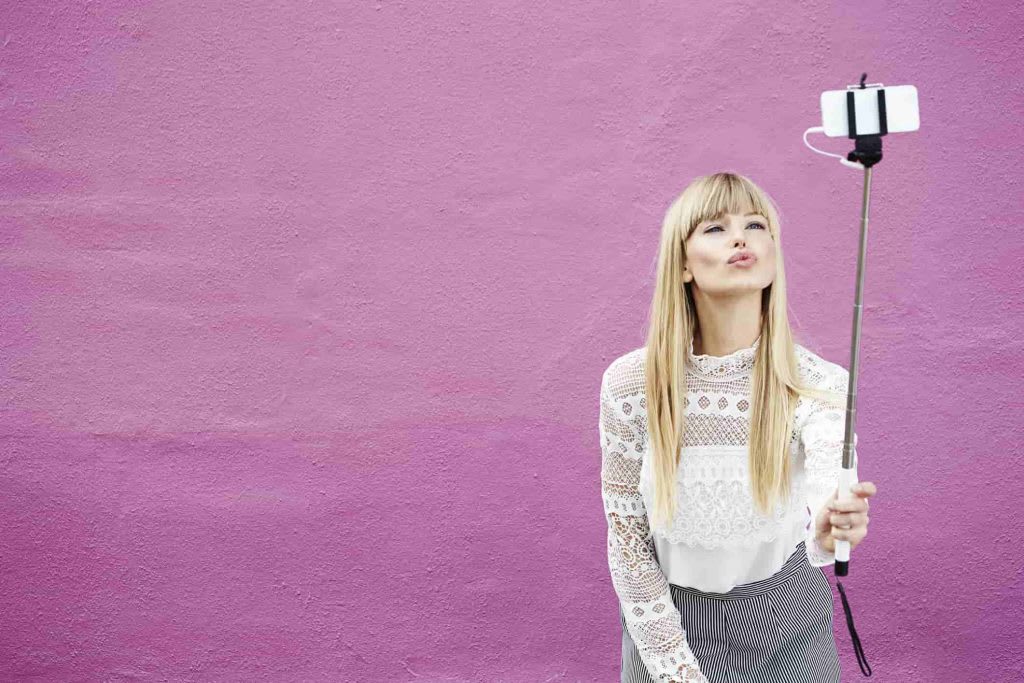 Use a selfie stick to take stunning images with iPhone photography.
