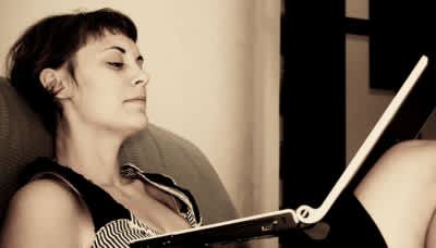 Woman thinking about her online course pricing options