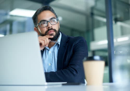 man thinking about choosing between bare metal vs virtual server