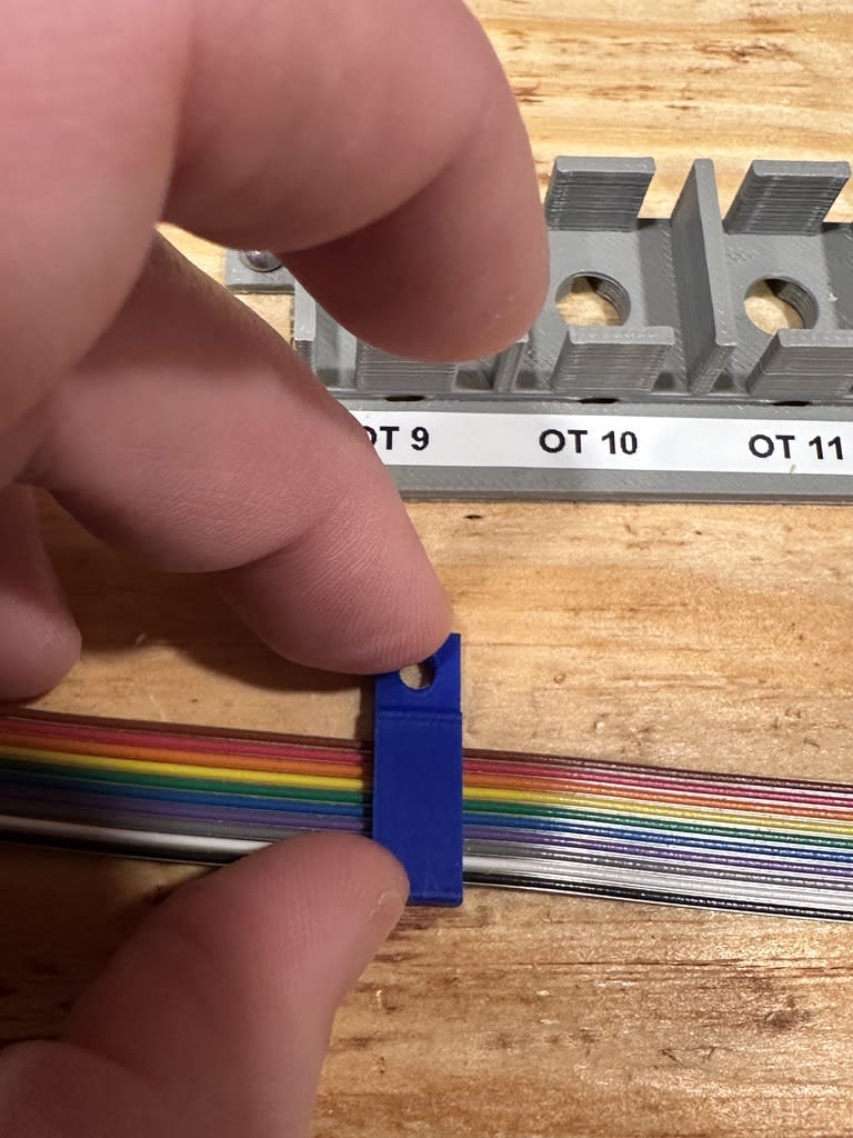 A close-up of the ribbon cable clamps I designed and printed.