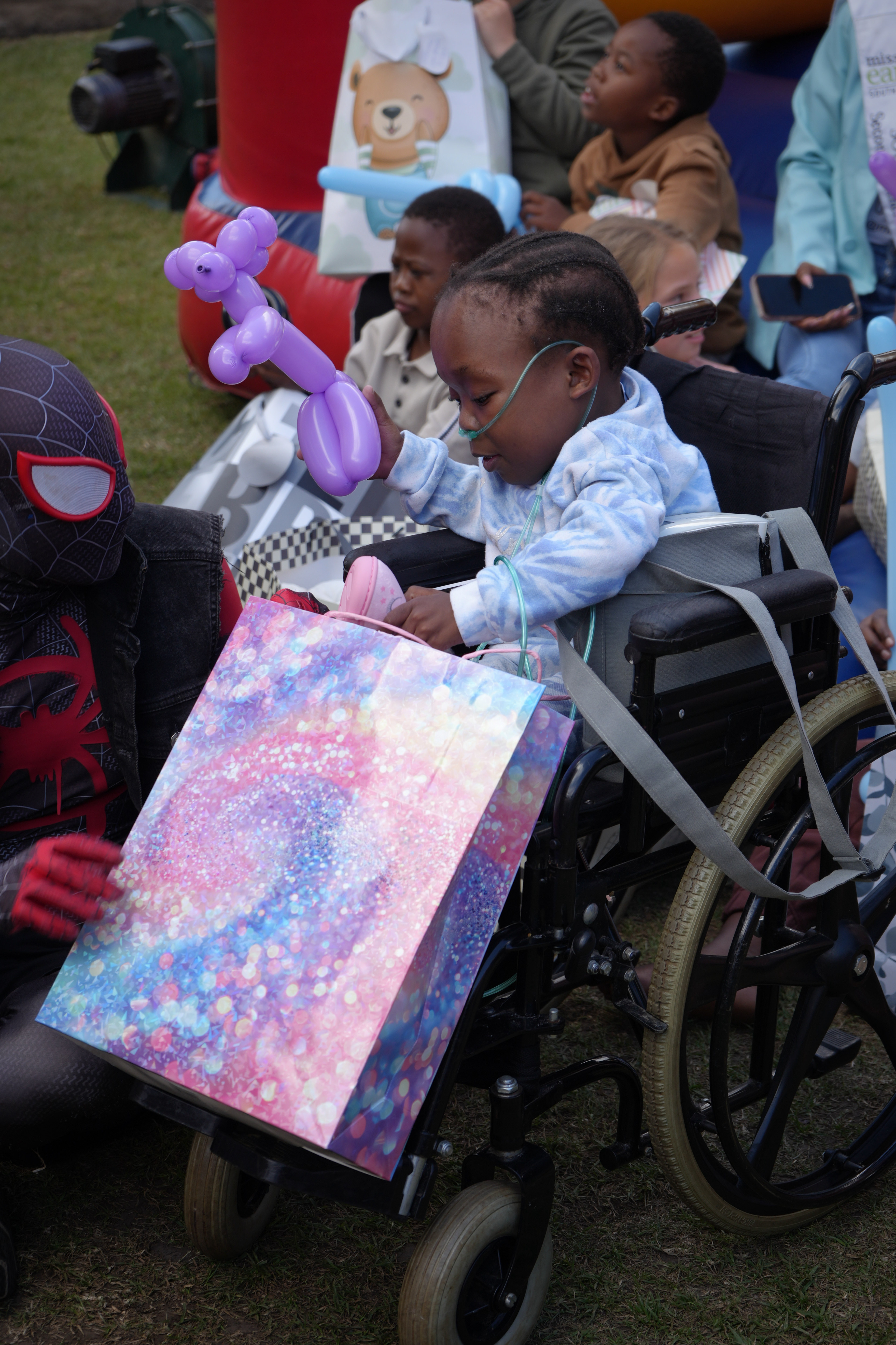 A child dressed as Spider-Man at Marang House Garden Day