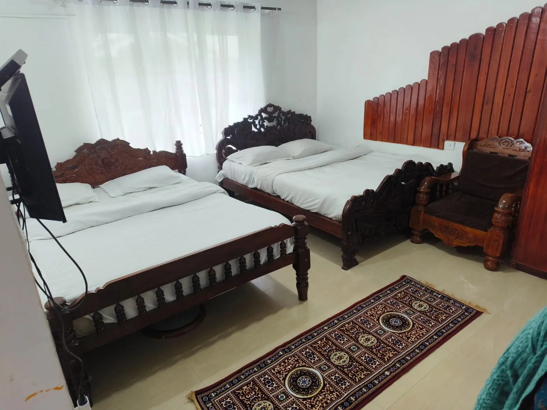 Spacious bedroom at Royal Aviary Cottage Ooty