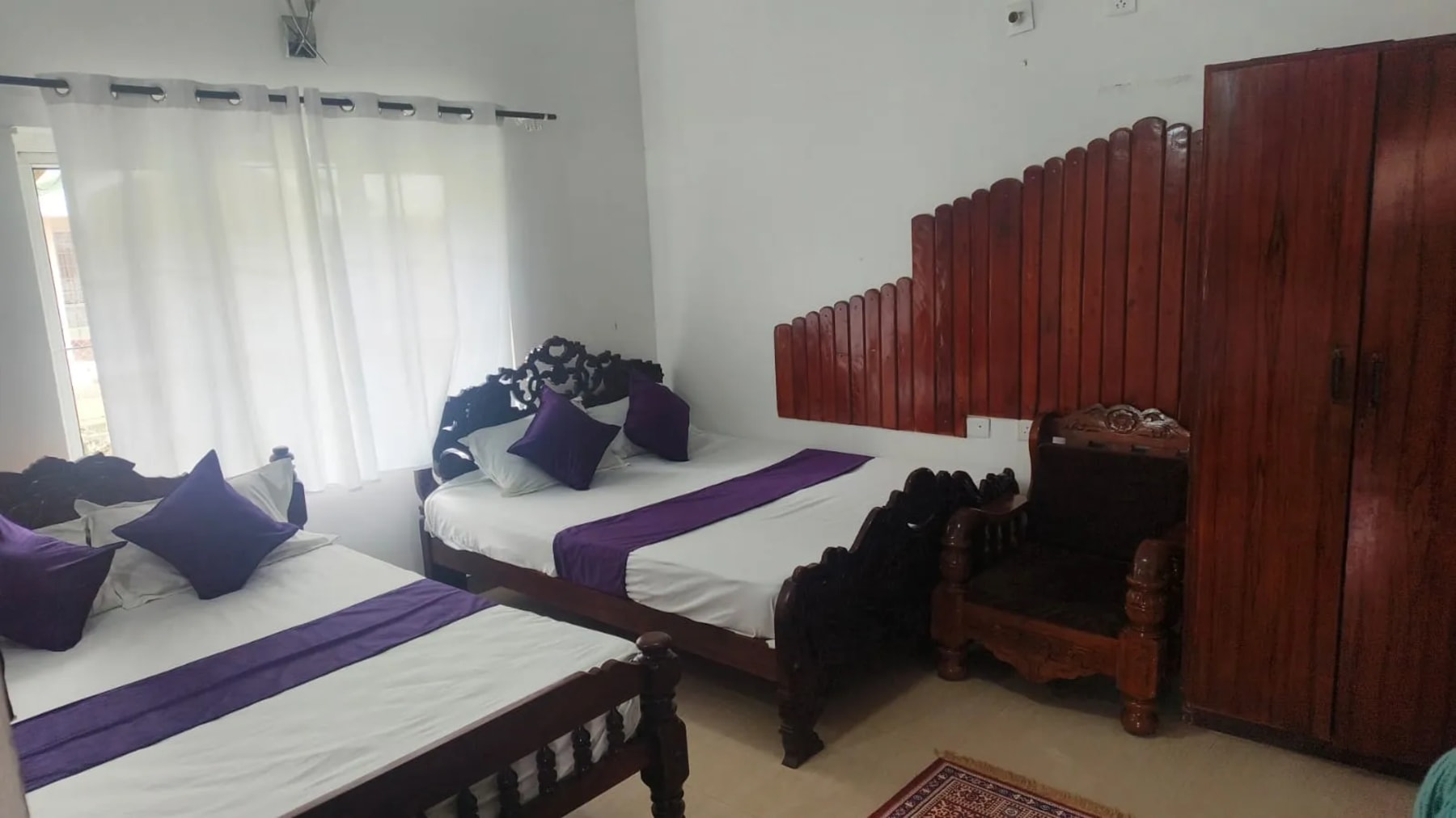 Comfortable bedroom in Royal Aviary Cottage Ooty