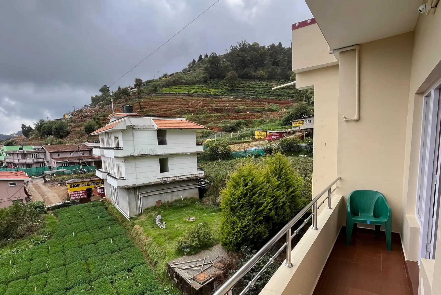 Balcony seating at Yoga Jay Homestay Ooty