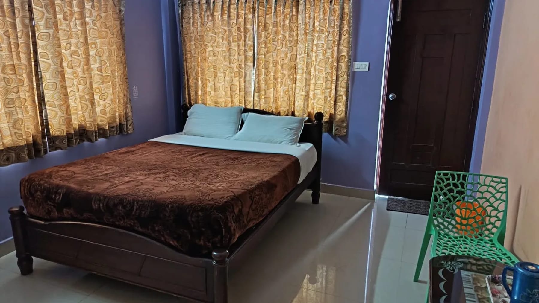 Comfortable bedroom at ADK Royal Park Inn Ooty