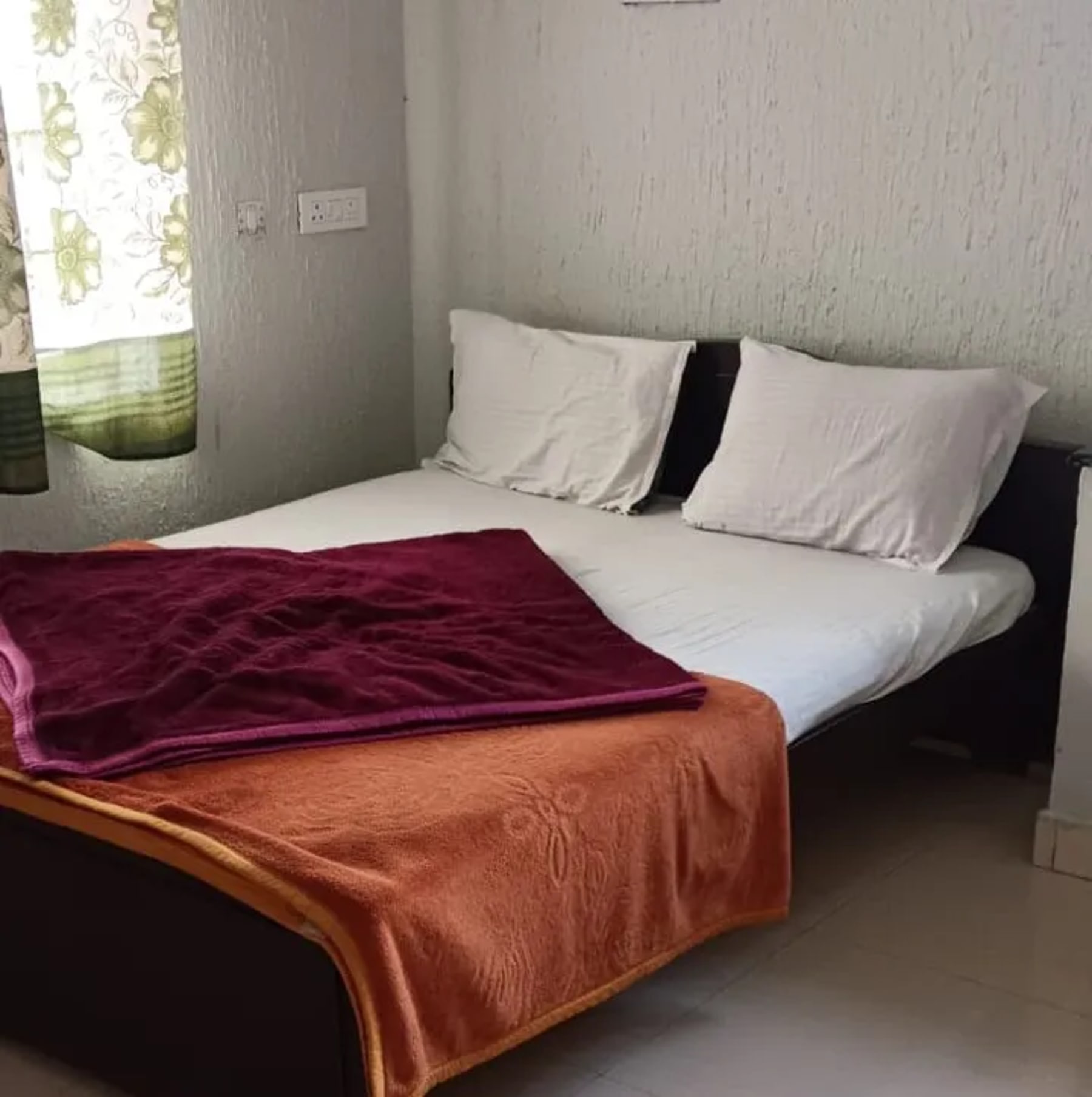 Bedroom at J.J. Homes Ooty homestay