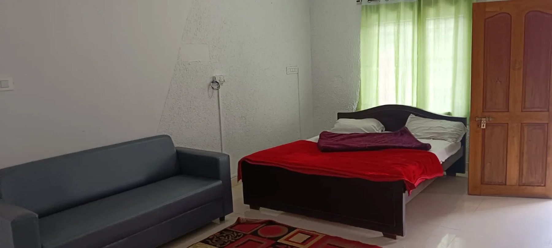 Comfortable room at J.J. Homes Ooty homestay