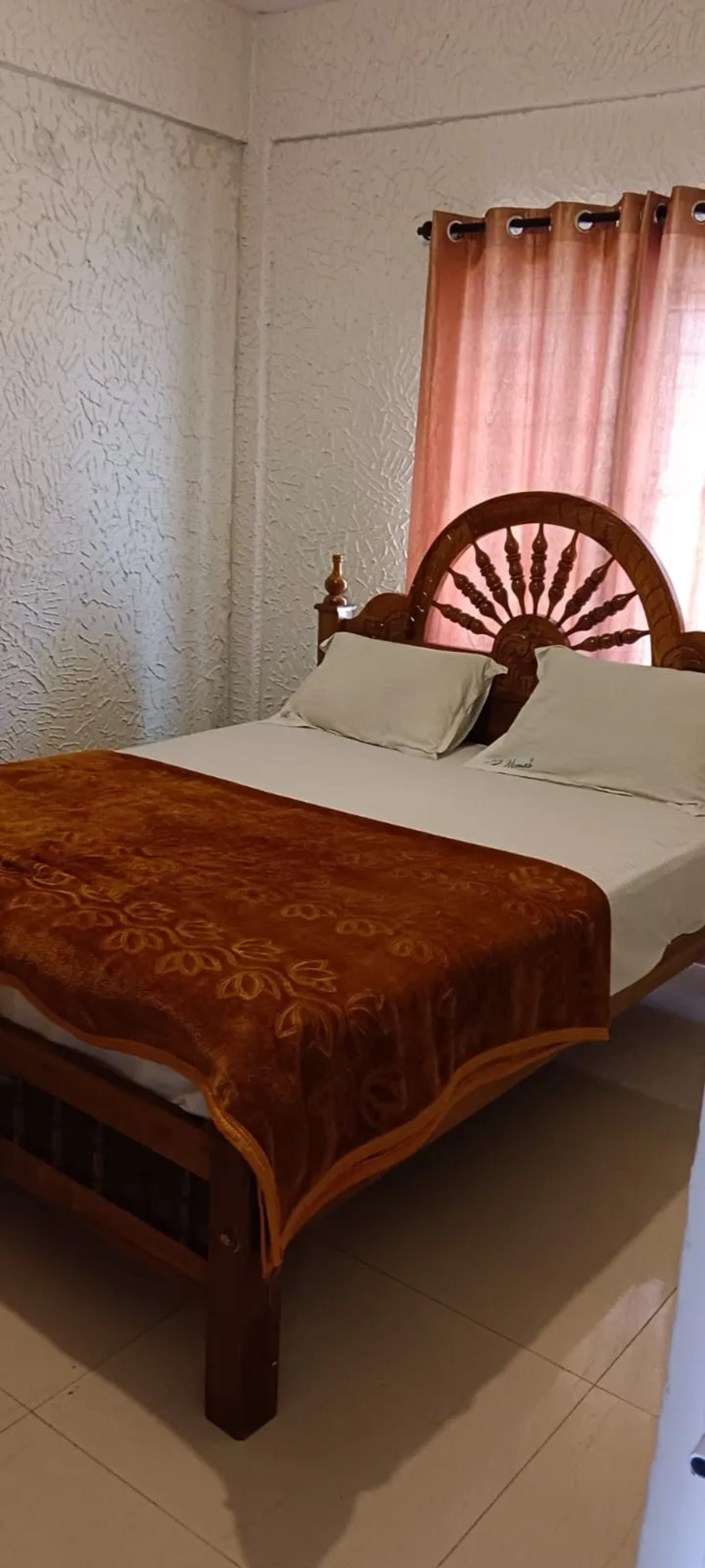 Spacious bedroom at J.J. Homes in Ooty