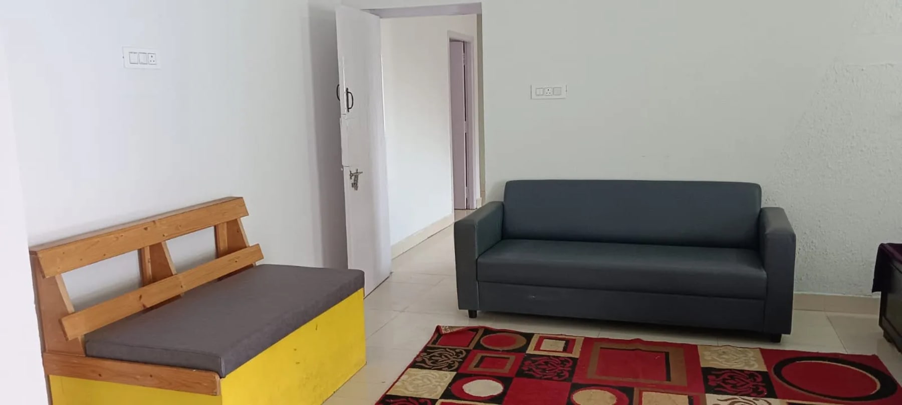Living area at J.J. Homes Ooty homestay
