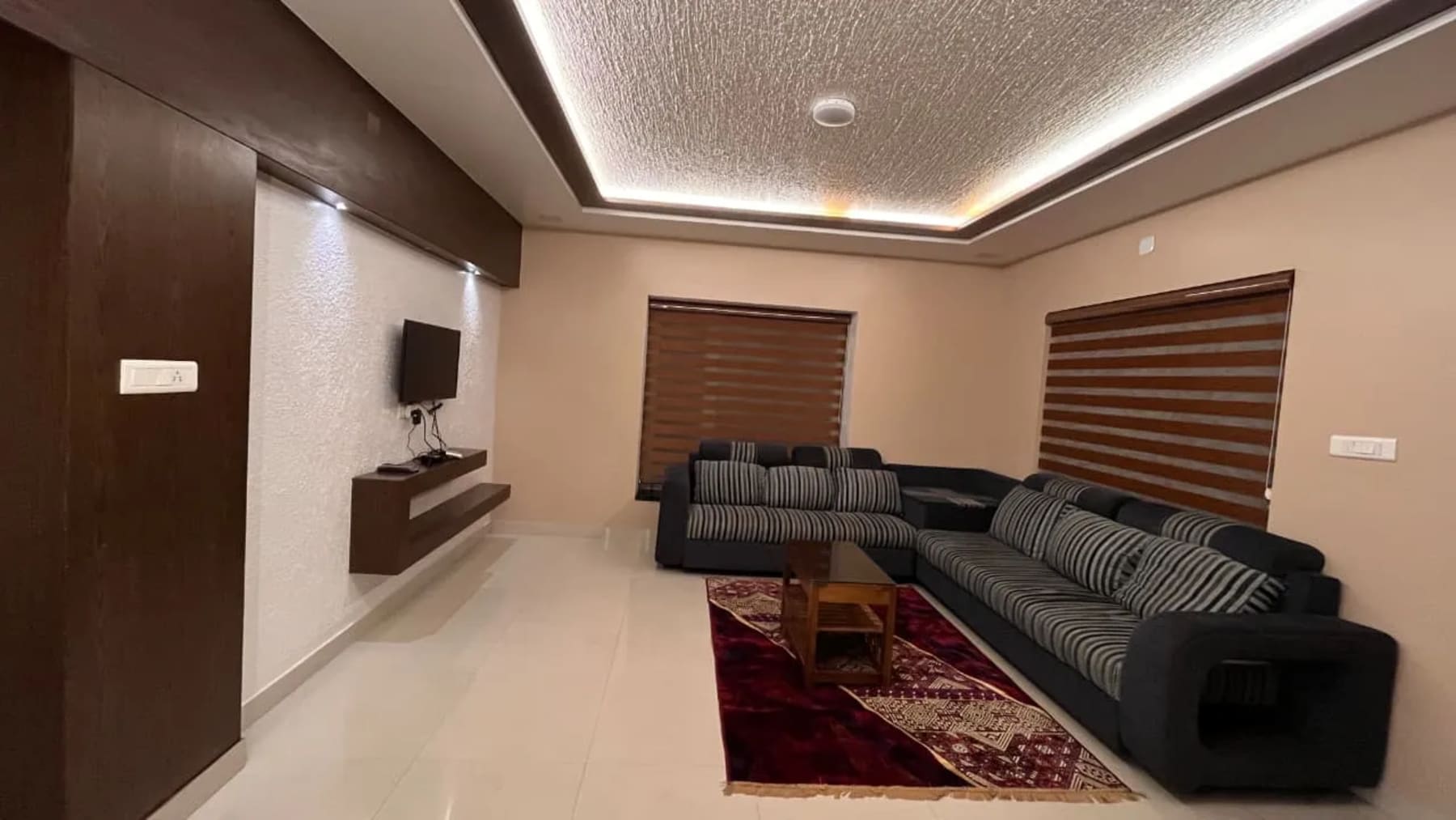 Living room at Central Residency Ooty homestay