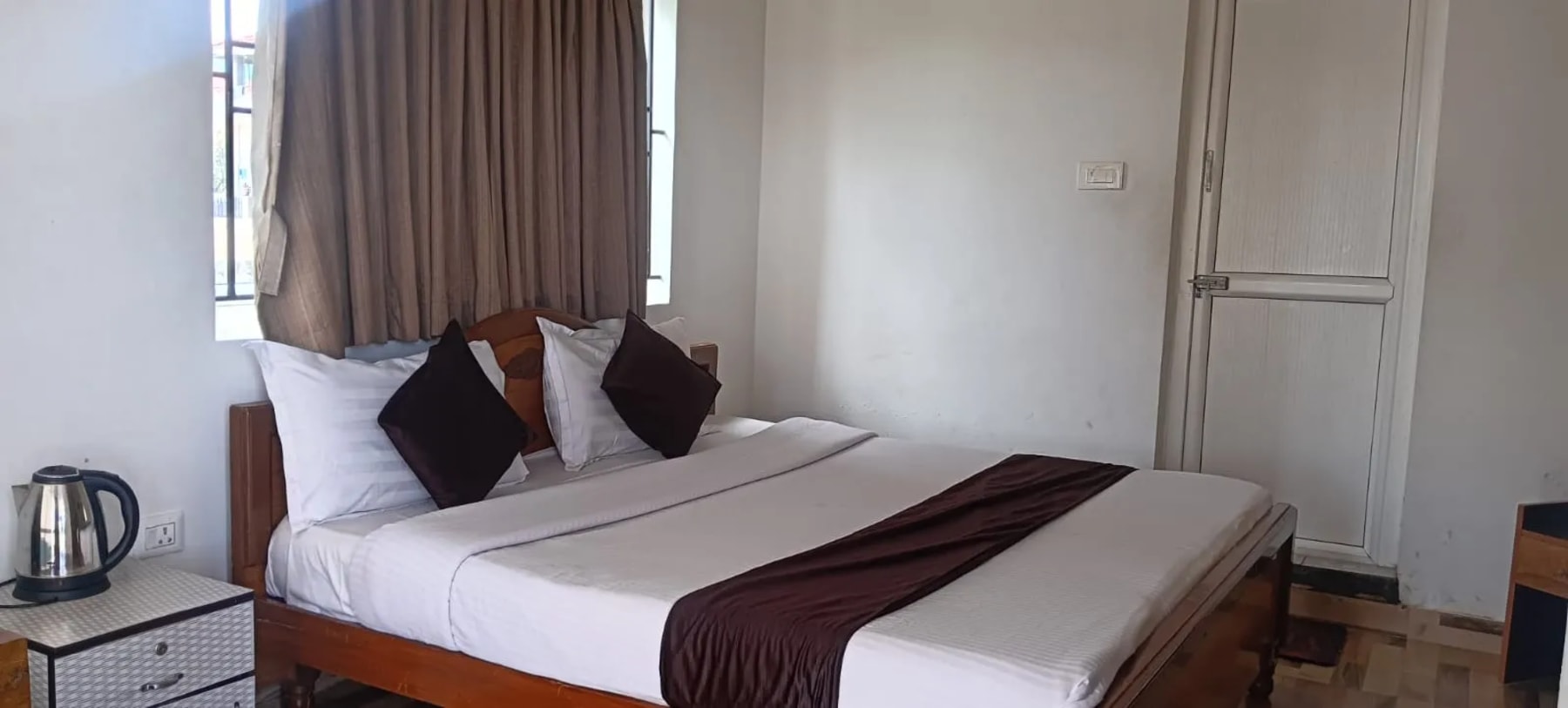 Comfortable guest room at Bala Garden Ooty