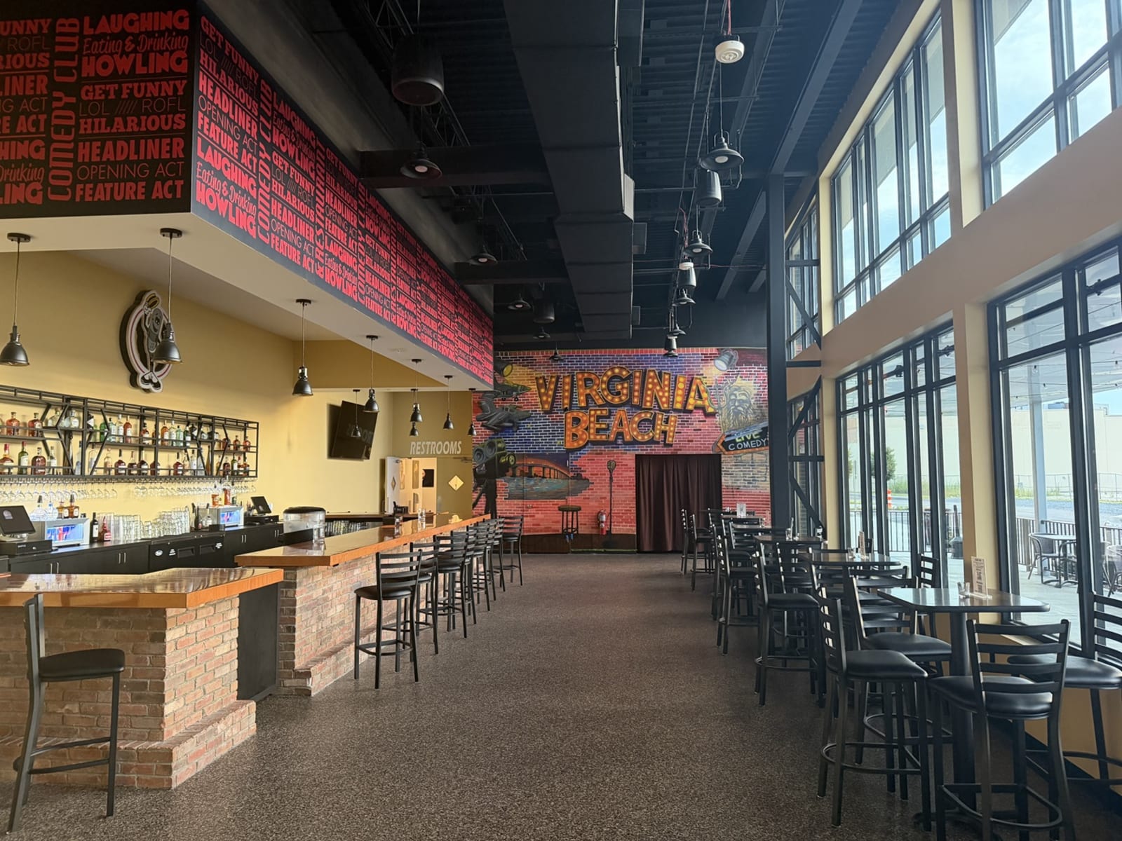 Virginia Beach Funny Bone Virginia Beach Funny Bone interior featuring custom comedy typography, venue graphics, and a Virginia Beach mural