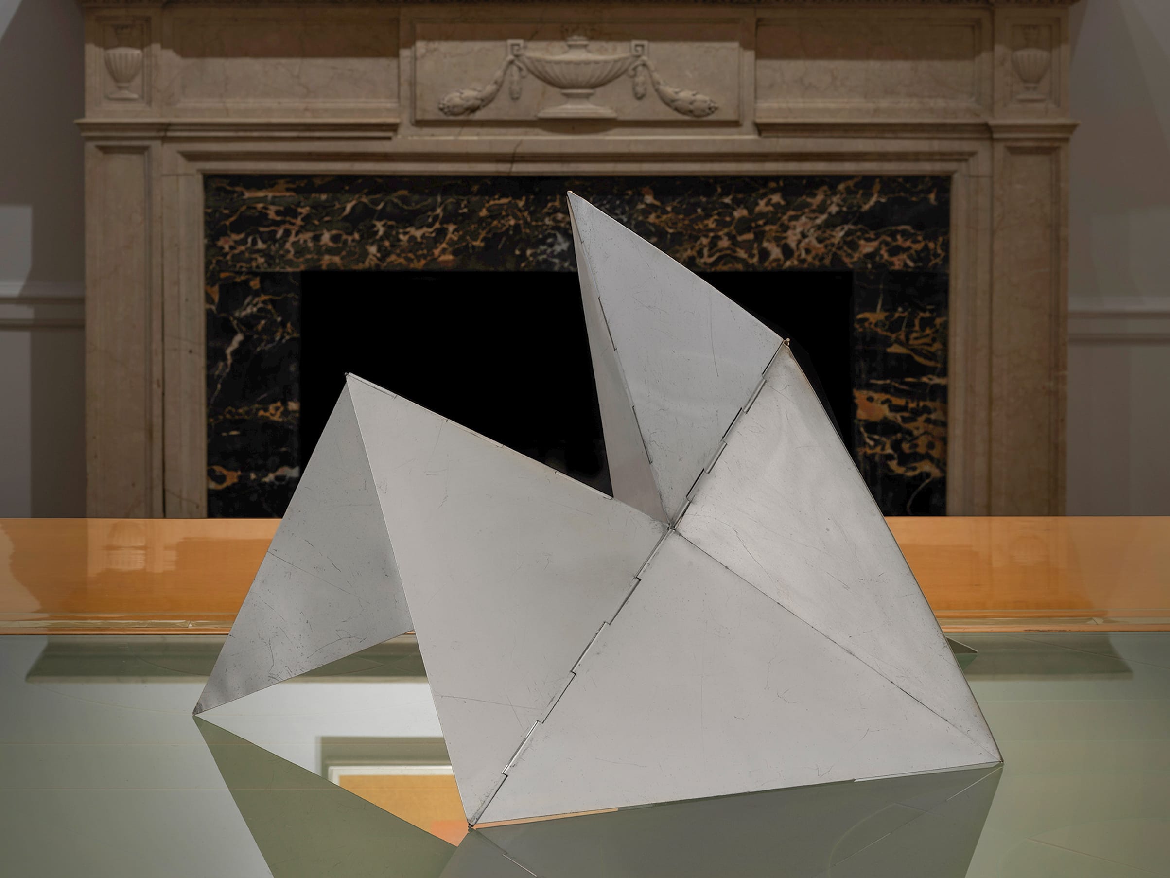 Installation view of Lygia Clark's Bicho, a foldable aluminum sculpture from 1960, in Minimal Means.