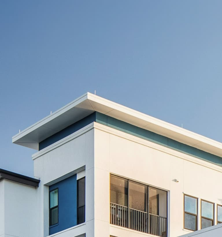 White office building against blue sky