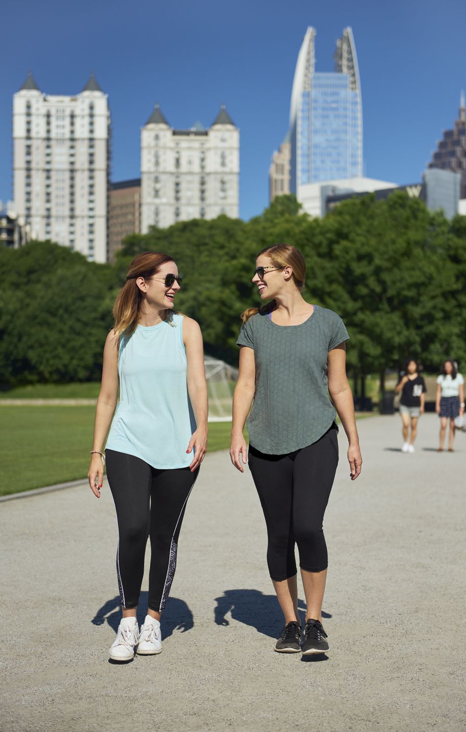 Two women walk outside