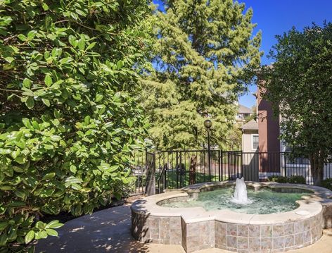 Courtyard fountain at Colonial Village at Oak Bend luxury apartment homes in Dallas, TX