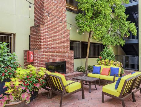 Outdoor entertainment area at Post Coles Corner luxury apartment homes in Dallas, TX