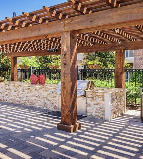 Outdoor grill area at Colonial Grand at Hebron luxury apartment homes in Dallas, TX