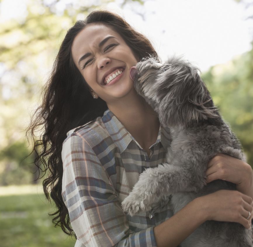 Woman holding dog