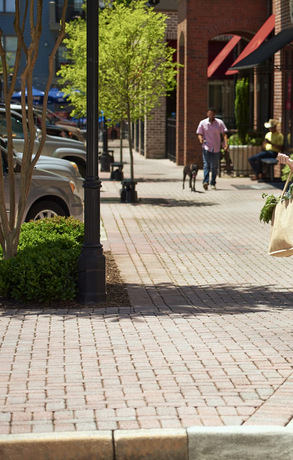 Two women walk near retail space talking