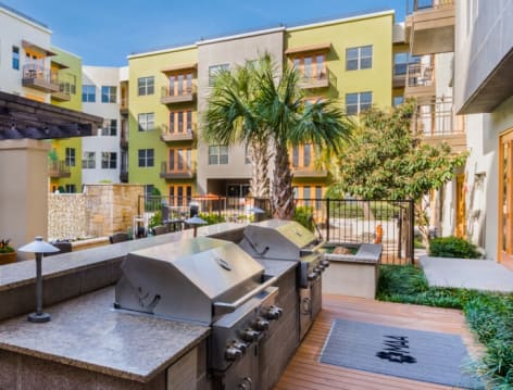 Outdoor grill area at Post Katy Trail luxury apartment homes in Dallas, TX