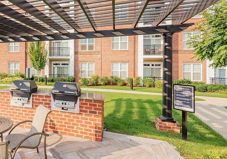 Grill area at The Apartments at Cobblestone Square in Fredericksburg, VA