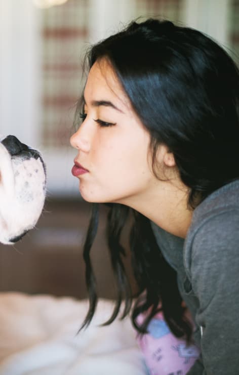 Woman and dog face to face
