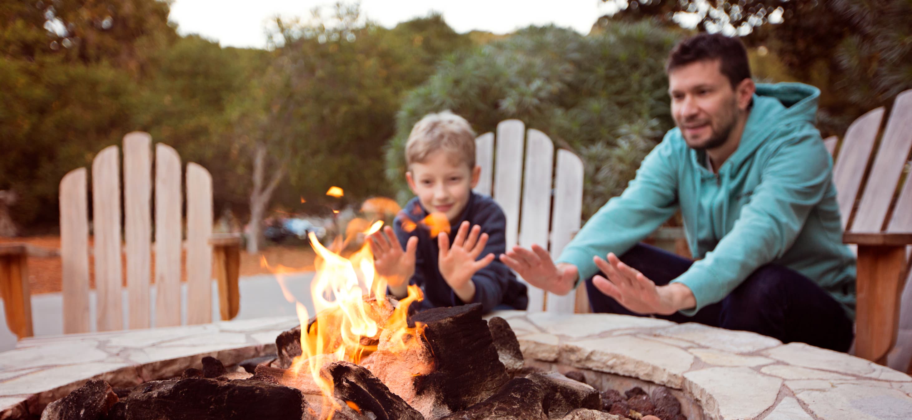 Dad and son enjoy the firepit