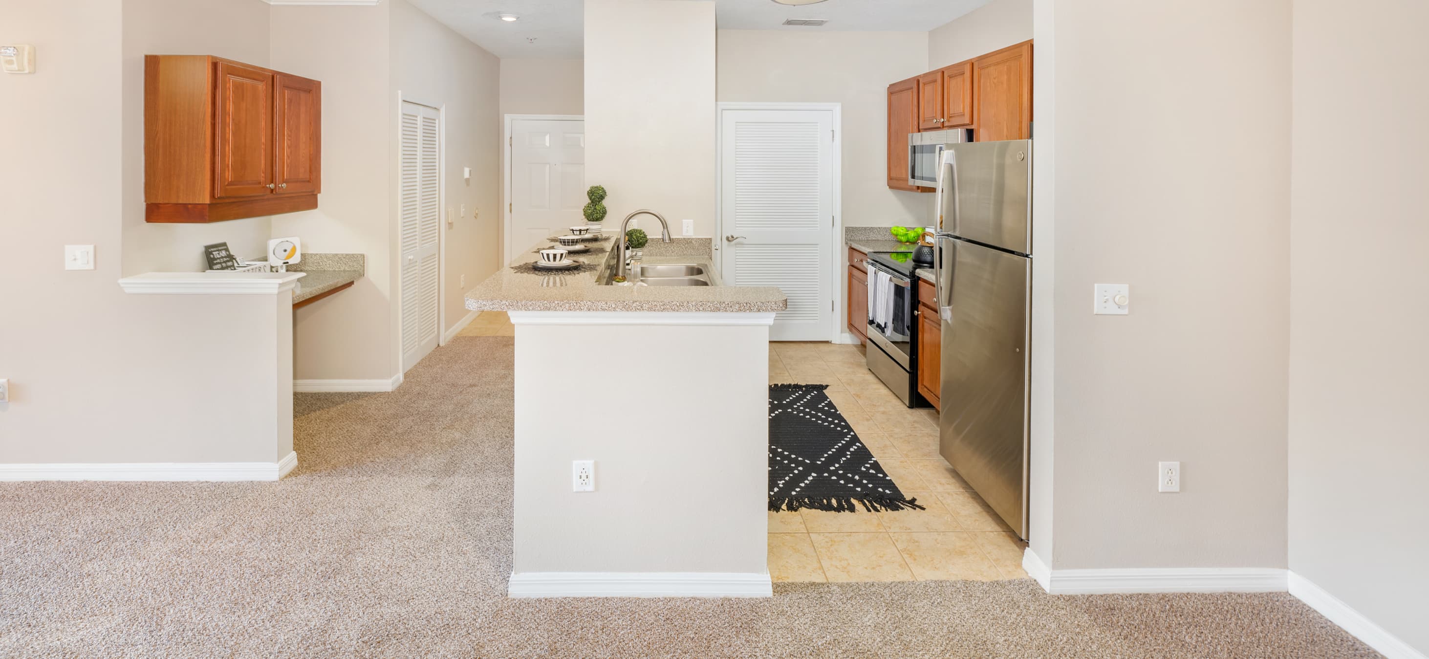 Kitchen and workspace at MAA Magnolia Parke luxury apartment homes in Gainesville, FL