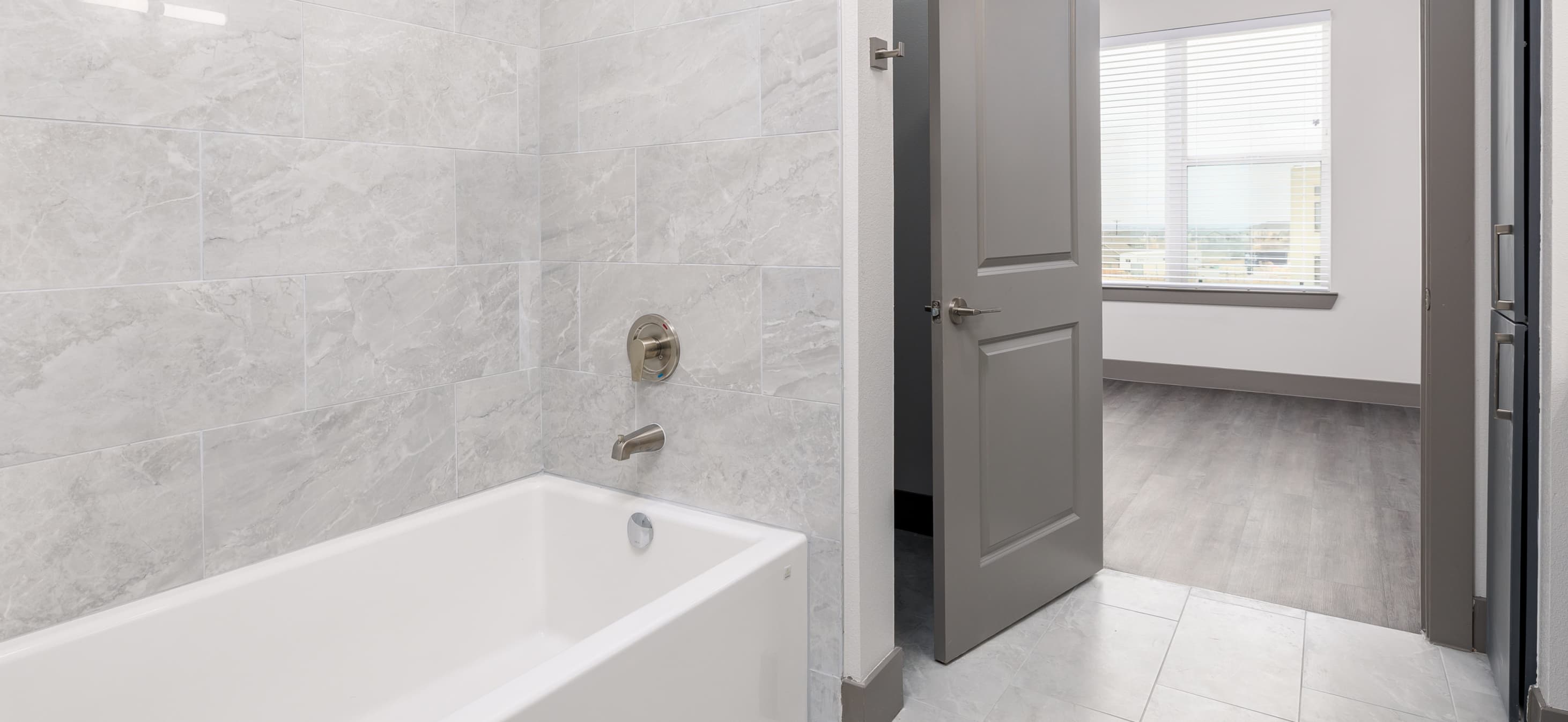 Bathroom with tub at MAA Windmill Hill Luxury Apartments in Austin, TX