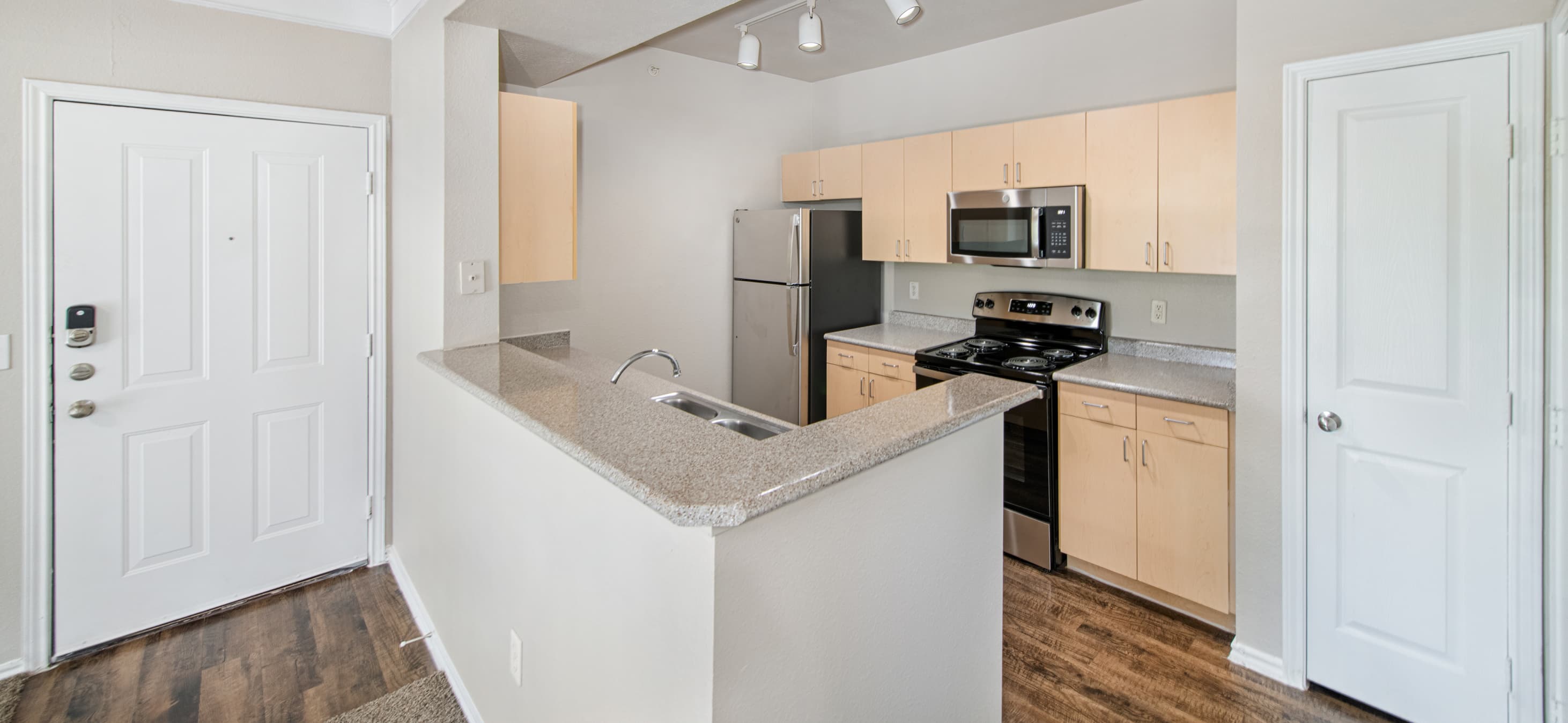 Kitchen at MAA Grand Courtyards luxury apartment homes in Gran Prairie, TX