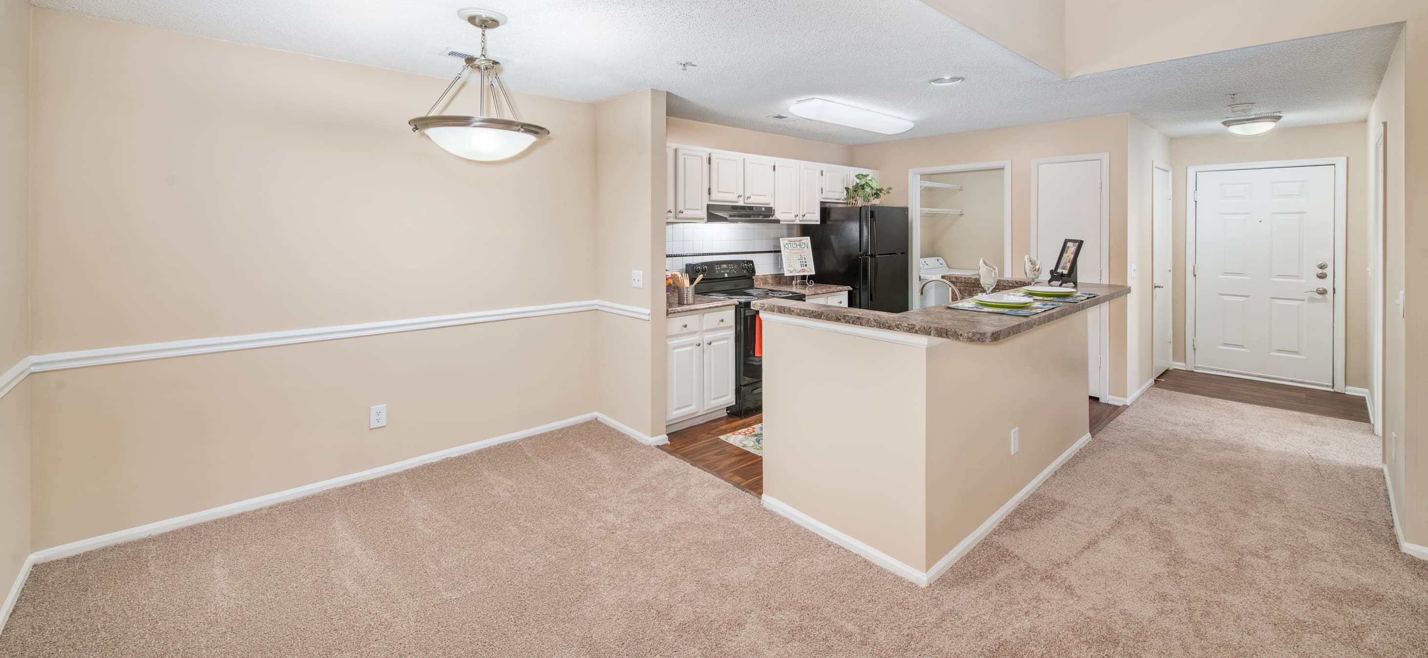 Dining room and kitchen at MAA Chancellor Park luxury apartment homes in Charlotte, NC