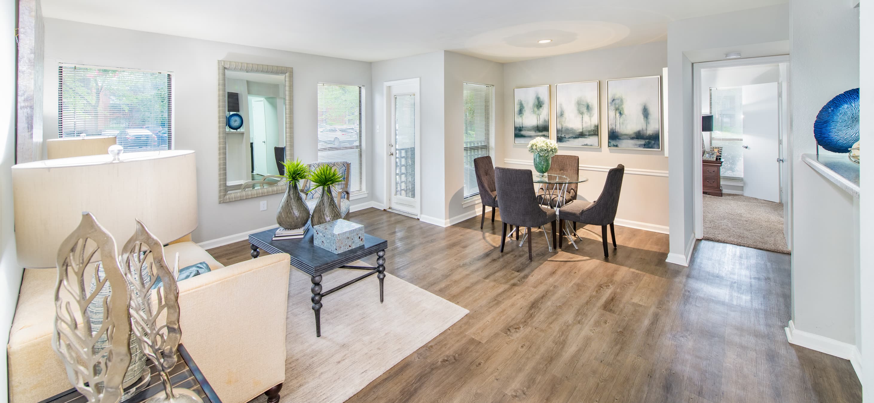 Living room and dining area at Lincoln on the Green luxury apartment homes in Memphis, TN