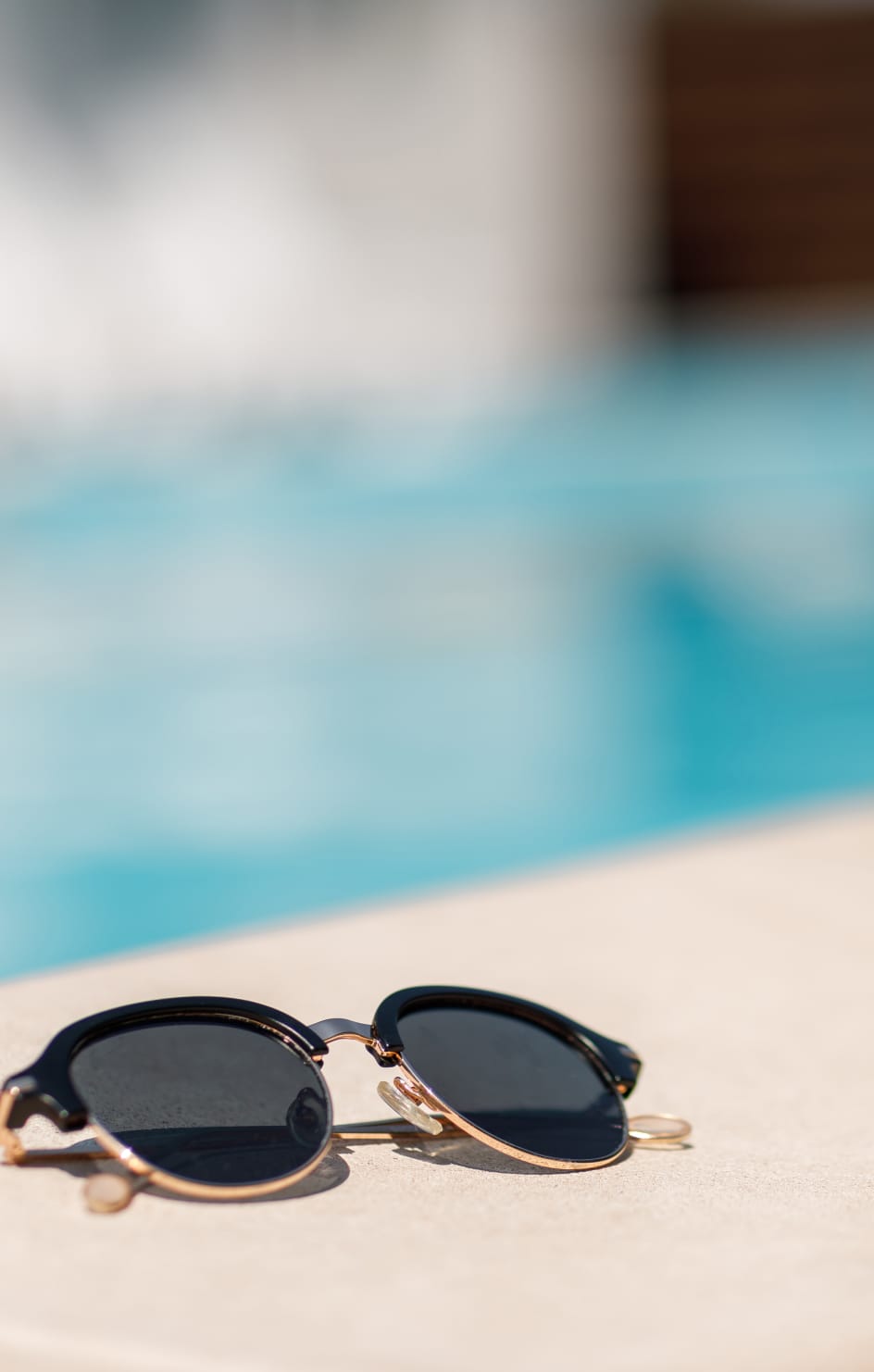 Sunglasses by pool