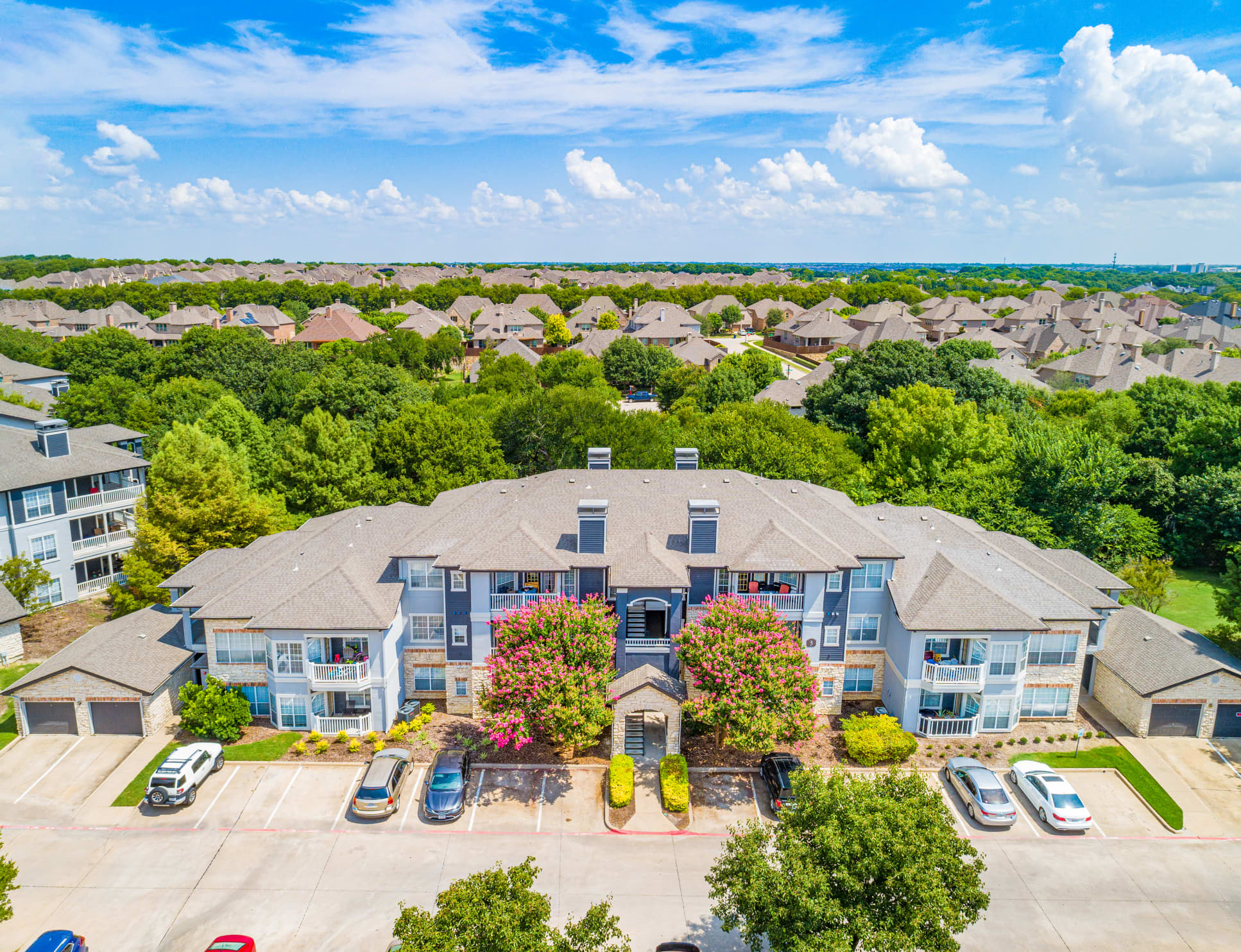 Building exterior at Venue at Stonebridge Ranch luxury apartment homes in McKinney, TX