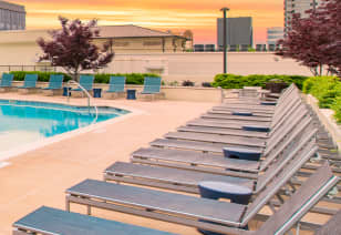 Lounge chairs poolside at MAA Centennial Park luxury apartments in Atlanta, GA