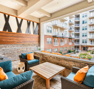 Outdoor lounge area viewing courtyard area at MAA Centennial Park luxury apartments in Atlanta, GA