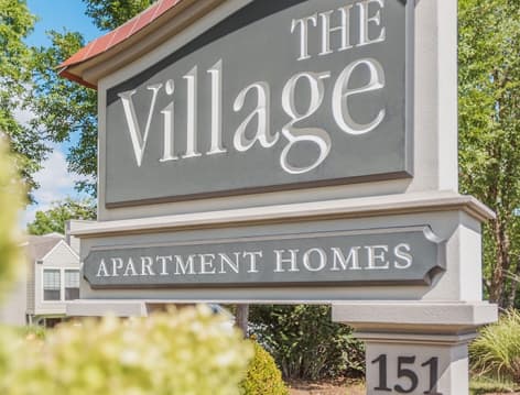 Signage of The Village luxury apartment homes in Lexington, KY