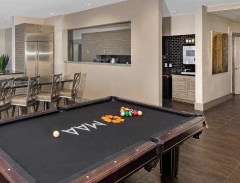 Game room & Kitchen at MAA 1225 luxury apartment homes in Charlotte, NC