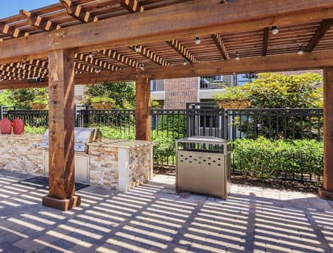 Outdoor grill area at Colonial Grand at Hebron luxury apartment homes in Dallas, TX