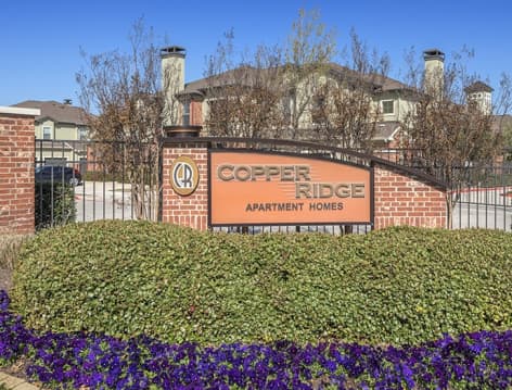 Entrance sign at Copper Ridge luxury apartment homes in Dallas, TX