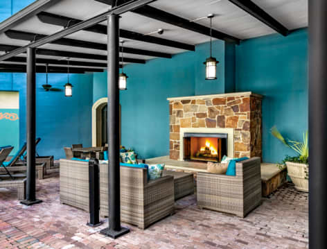Fireplace at Pool at Post Addison Circle luxury apartment homes in Dallas, TX