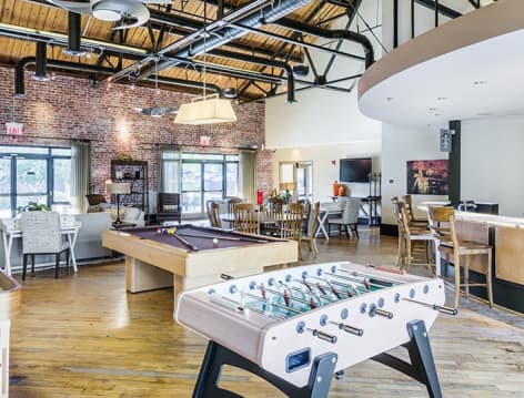 Game room at The Apartments at Cobblestone Square in Fredericksburg, VA