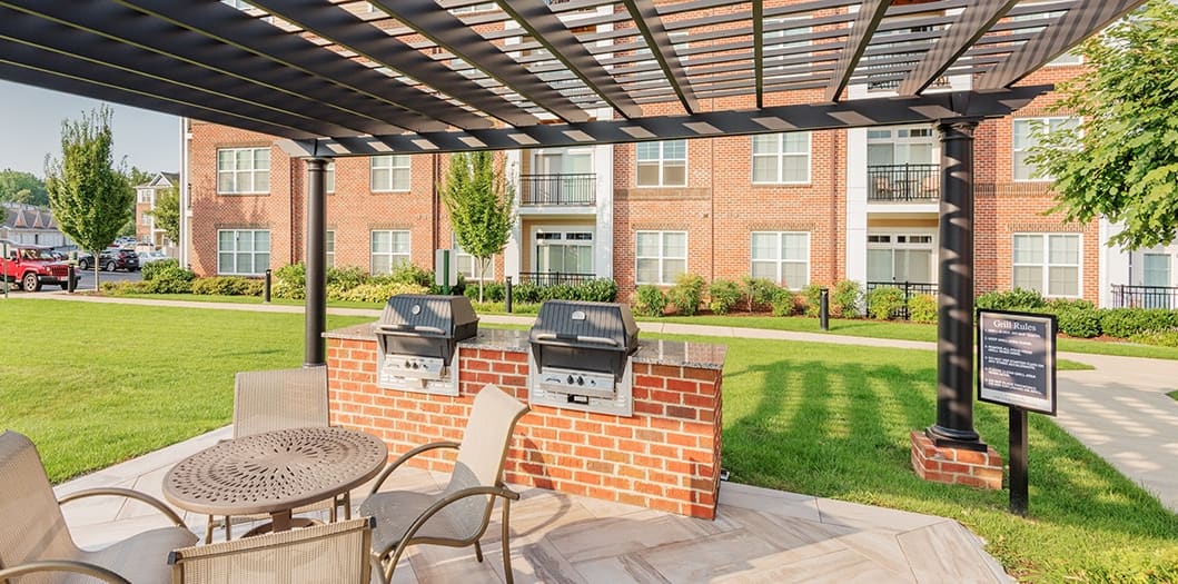 Grill area at The Apartments at Cobblestone Square in Fredericksburg, VA