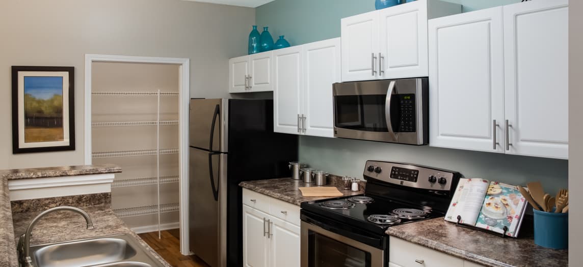 Kitchen & Living Room at MAA Barrett Creek luxury apartment homes in Atlanta, GA