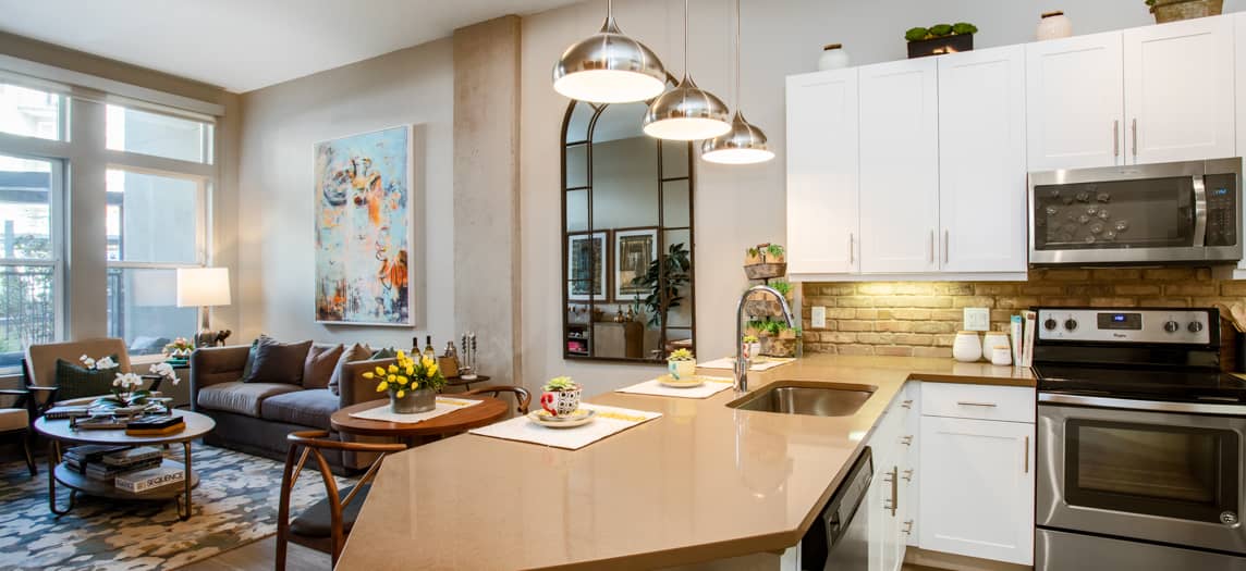 Living Room and Kitchen at Post River North luxury apartment homes in Denver, CO