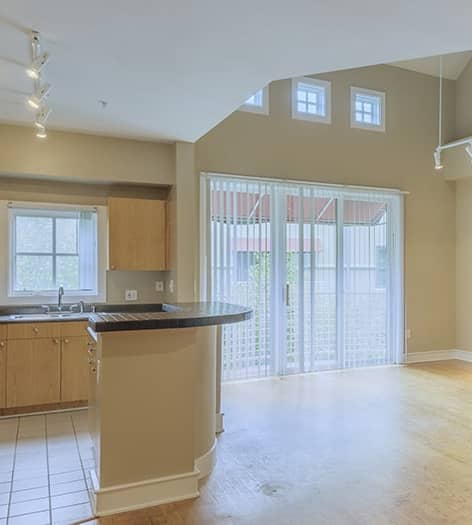 Kitchen and living room at MAA Abbey luxury apartment homes in Dallas, TX