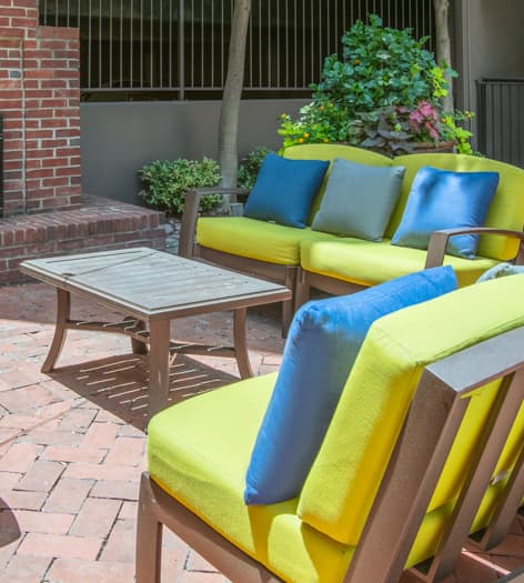 Outdoor entertainment area at Post Coles Corner luxury apartment homes in Dallas, TX